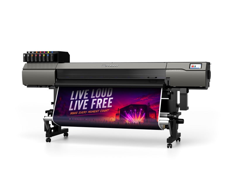 Roland TrueVIS MG2-640 UV printer/cutter, angled view, banner on the take-up unit