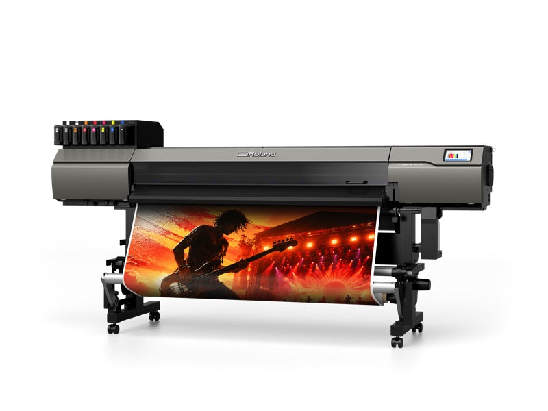 Roland TrueVIS MG2-640 UV printer/cutter, angled view, printing a concert graphic